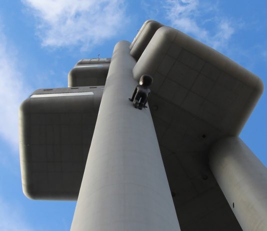 25 years of Zizkov TV Tower with Baby Crawling